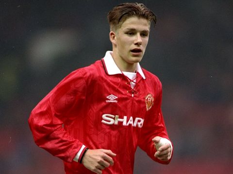 An 18-year-old Beckham runs out for his boyhood club Manchester United in 1993.