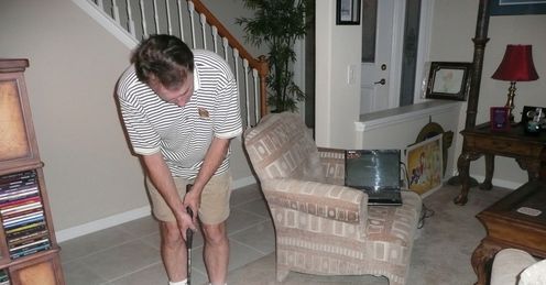 Simon tries out the Palmbird putter in his Orlando living room