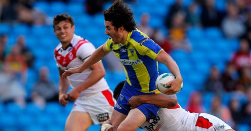 Stefan Ratchford C of Warrington is tackled by Sia Soliola Stefan Ratchford C of Warrington is tackled by Sia Soliola