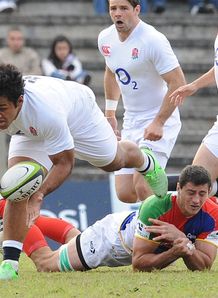 Billy Vunipola L of England gets past Antonio Ahualli of a South America Billy Vunipola L of England gets past Antonio Ahualli of a South America