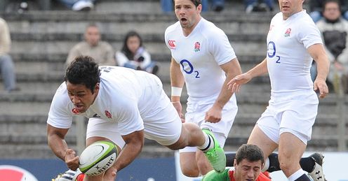Billy Vunipola L of England gets past Antonio Ahualli of a South America Billy Vunipola L of England gets past Antonio Ahualli of a South America