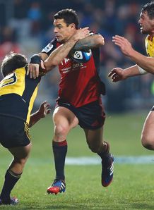 Dan Carter of The Crusaders is tacled The Hurricanes Dan Carter of The Crusaders is tacled The Hurricanes
