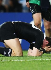 Colin Slade of the All Blacks holds his head Colin Slade of the All Blacks holds his head
