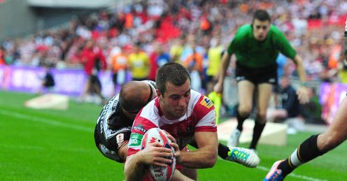 Wigan Warriors Iain Thornley scores a try under pressure from Hull FC s Danny Houghton Wigan Warriors Iain Thornley scores a try under pressure from Hull FC s Danny Houghton
