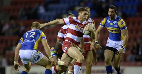 Gil Dudson of Wigan gets past Carl Ablett and Ryan Bailey of Leeds Gil Dudson of Wigan gets past Carl Ablett and Ryan Bailey of Leeds