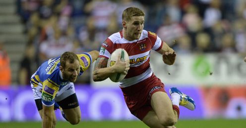Sam Tomkins of Wigan gets past Rob Burrow of Leeds Sam Tomkins of Wigan gets past Rob Burrow of Leeds