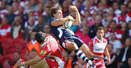 Tom Arscott of Sale Sharks feels the force of a challenge from Rob Cook L of Gloucester Tom Arscott of Sale Sharks feels the force of a challenge from Rob Cook L of Gloucester