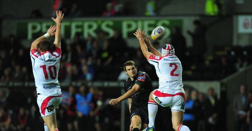 Ospreys fly half Dan Biggar c has his attempted drop goal kick knocked down by Ulster hooker Rory Best r Ospreys fly half Dan Biggar c has his attempted drop goal kick knocked down by Ulster hooker Rory Best r