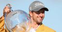 Scott hangs on to win Masters