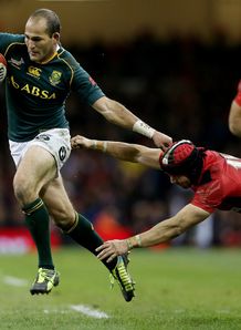 Fourie Du Preez of South Africa beats Leigh Halfpenny of Wales Fourie Du Preez of South Africa beats Leigh Halfpenny of Wales