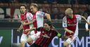Milan scrape into last 16