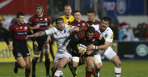 Alex Goode of Saracens is tackled by Matt Smith Alex Goode of Saracens is tackled by Matt Smith