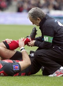 Toulouse s fullback Clement Poitrenaud lays on the field after a knee injury Toulouse s fullback Clement Poitrenaud lays on the field after a knee injury