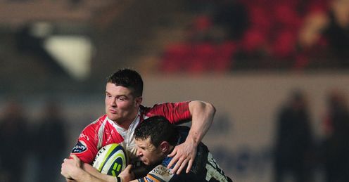 Gloucester scrum half Travis Knoyle breaks the tackle of Adam Warren Gloucester scrum half Travis Knoyle breaks the tackle of Adam Warren