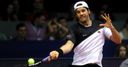 Haas battles into semis