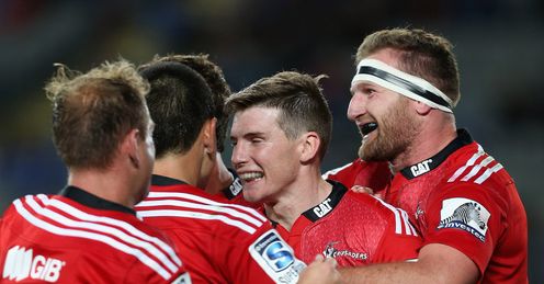 Colin Slade congratulated after scoring for Crusaders Colin Slade congratulated after scoring for Crusaders