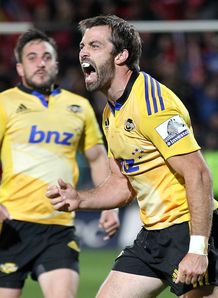 Conrad Smith R of the Hurricanes celebrates with team-mates Conrad Smith R of the Hurricanes celebrates with team-mates
