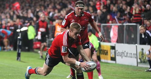 Johnny McNicholl of the Crusaders dives over to score a try Johnny McNicholl of the Crusaders dives over to score a try