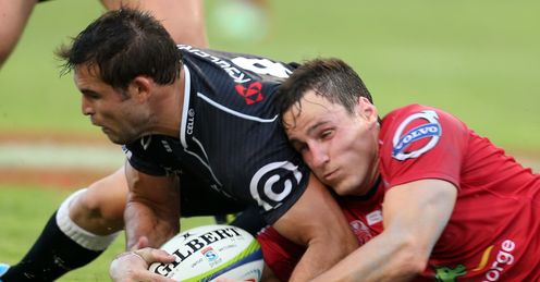 Cobus Reinach of the Cell C Sharks and Mike Harris of the Reds Cobus Reinach of the Cell C Sharks and Mike Harris of the Reds