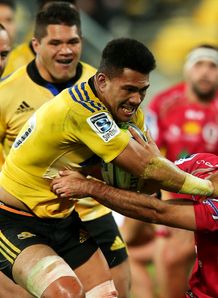 Ardie Savea of the Hurricanes fends Nick Frisby of the Reds on his way to scoring a try Ardie Savea of the Hurricanes fends Nick Frisby of the Reds on his way to scoring a try