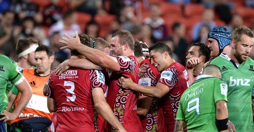Reds pack celebrate try v Highlanders Reds pack celebrate try v Highlanders
