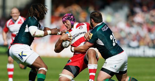 Sione Kalamafoni of Gloucester is tackled by Gerard Ellis of London Irish R Sione Kalamafoni of Gloucester is tackled by Gerard Ellis of London Irish R