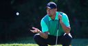 Woods off the pace
