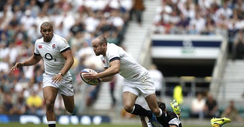 Barbarians Tomas Cubelli R tackles England s left wing Charlie Sharples Barbarians Tomas Cubelli R tackles England s left wing Charlie Sharples