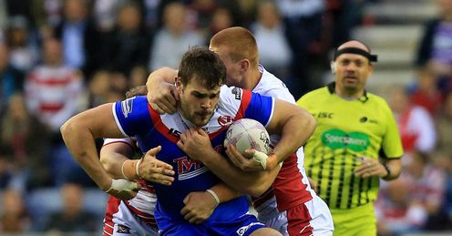 RUGBYL WIGAN ST HELENS' ALEX WALMSLEY IS TACKLED BY WIGAN WARRIORS' JACK HUGHES RUGBYL WIGAN ST HELENS' ALEX WALMSLEY IS TACKLED BY WIGAN WARRIORS' JACK HUGHES