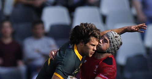 SOUTH AFRICAN CENTRE JAN SERFONTEIN (L) IS TACKLED BY WALES JON DAVIES (R) SOUTH AFRICAN CENTRE JAN SERFONTEIN (L) IS TACKLED BY WALES JON DAVIES (R)