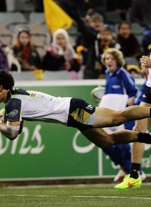 Brumbies back Matt Toomua diving over for a try Brumbies back Matt Toomua diving over for a try