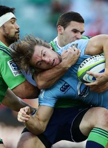 Waratahs wing Rob Horne held by Highlanders flank Shane Christie on left Waratahs wing Rob Horne held by Highlanders flank Shane Christie on left