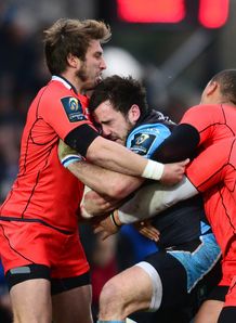 Alex Dunbar of Glasgow Warriors is stopped by Maxime Medard of Toulouse during the European Rugby Champions Cup Pool 4 match