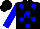 Black, blue circles and 'CC' and 'RS', blue sleeves, black cap