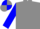Grey body, blue arms, grey cap, blue quartered