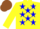 Yellow body, blue stars, yellow arms, brown cap
