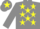 Grey body, yellow stars, grey arms, grey cap, yellow star