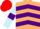 Beige, purple chevrons, light blue sleeves, purple armlets, red cap