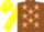 Brown, beige stars, yellow sleeves and cap