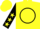 Yellow, black circle and 'l', black sleeves, yellow stars, yellow cap