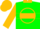 Green, gold circle, gold collar and hoop on sleeves, gold cap, green visor