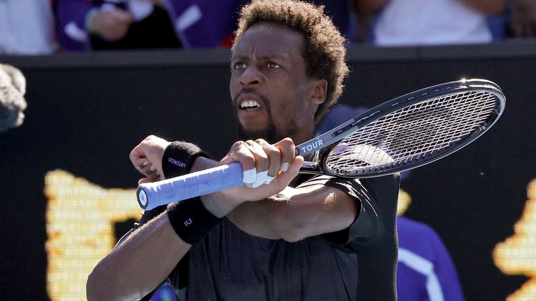 Gael Monfils of France reacts after defeating Cristian Garin of Chile in their third round match at the Australian Open tennis championships in Melbourne, Australia, Friday, Jan. 21, 2022. (AP Photo/Hamish Blair)