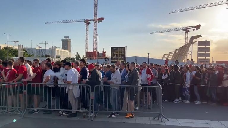 Supporters queue to get into the Stade de France