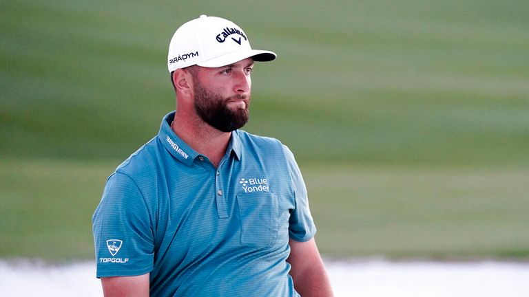 Jon Rahm watches his sand shot on the 18th hole during the third round of the Phoenix Open golf tournament, Saturday, Feb. 11, 2023, in Scottsdale, Ariz. 