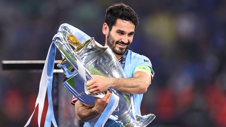 Ilkay Gundogan of Manchester City holds the UEFA Champions League trophy