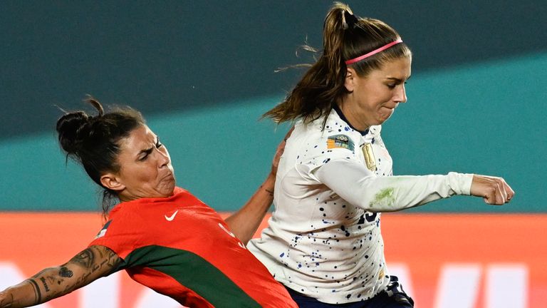 United States&#39; Alex Morgan, right, attempts a shot as Portugal&#39;s Ana Borges blocks during the Women&#39;s World Cup Group E soccer match between Portugal and the United States at Eden Park in Auckland, New Zealand, Tuesday, Aug. 1, 2023. (AP Photo/Andrew Cornaga)