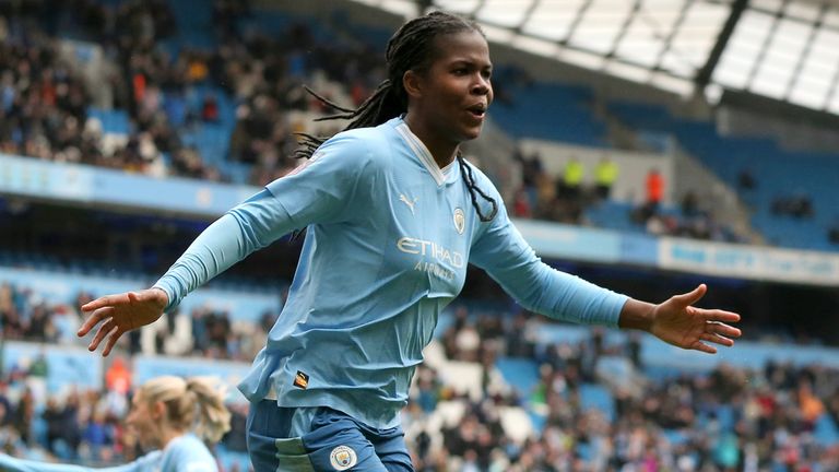 Man City&#39;s Bunny Shaw celebrates scoring their third goal against Man Utd