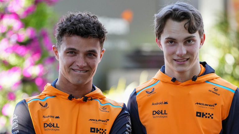 McLaren driver&#39;s Lando Norris, left, of Britain and Oscar Piastri of Australia react ahead of the Australian Formula One Grand Prix at Albert Park, Melbourne, Australia, Thursday, March 21, 2024. (AP Photo/Asanka Brendon Ratnayake)