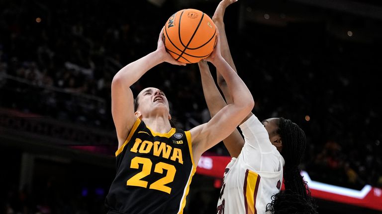 Iowa guard Caitlin Clark (22) shoots over South Carolina guard Bree Hall during the second half of the Final Four college basketball championship game in the women&#39;s NCAA Tournament, Sunday, April 7, 2024, in Cleveland. (AP Photo/Morry Gash)