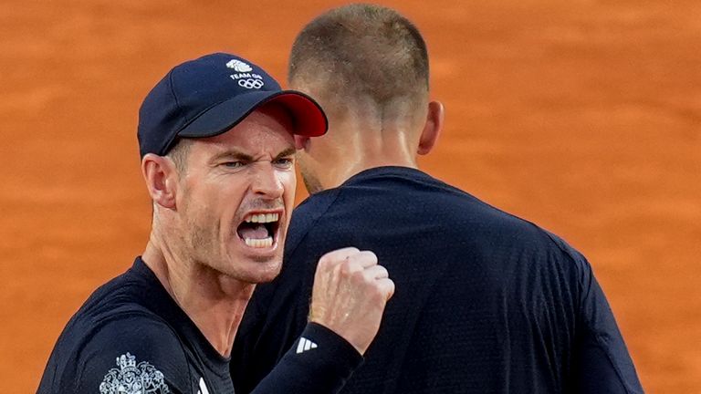 Andy Murray, left, and Daniel Evans of Britain celebrate a point during their match against Joran Vliegen and Sander Gille of Belgium during the men&#39;s doubles tennis competition at the Roland Garros stadium, at the 2024 Summer Olympics, Tuesday, July 30, 2024, in Paris, France. (AP Photo/Manu Fernandez)